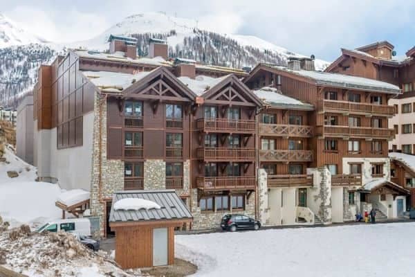 Ski-in/ski-out chalet exterior with private balconies and mountain views