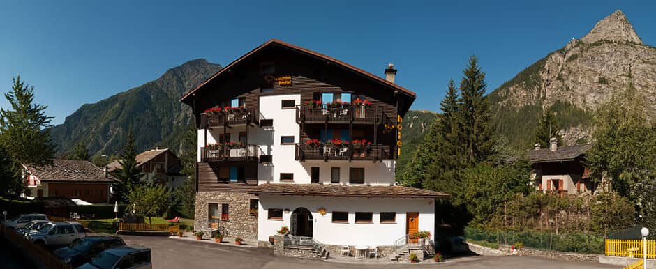 Chalet exterior with private balconies and on-site parking area