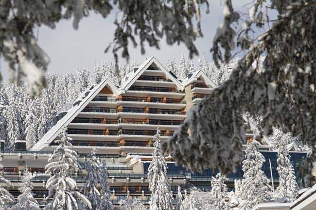 Ski-in/ski-out resort exterior with private balconies and mountain views