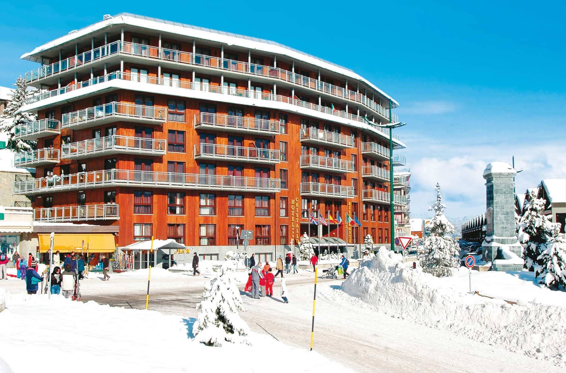 Ski-in access building with private balconies and ground-floor gear shop