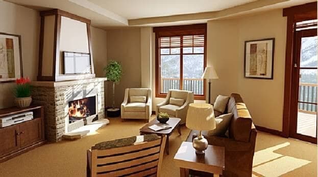 Living room with stone fireplace and balcony access to mountain views