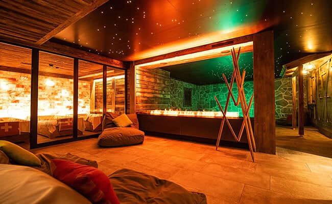 Spa lounge featuring fiber optic starlight ceiling and linear fireplace