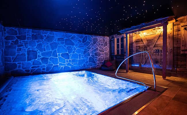 Indoor heated pool with fiber optic starlight ceiling and rainfall showers