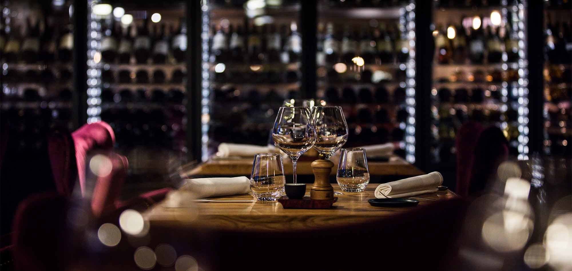 Wine cellar dining room with floor-to-ceiling chilled bottle storage