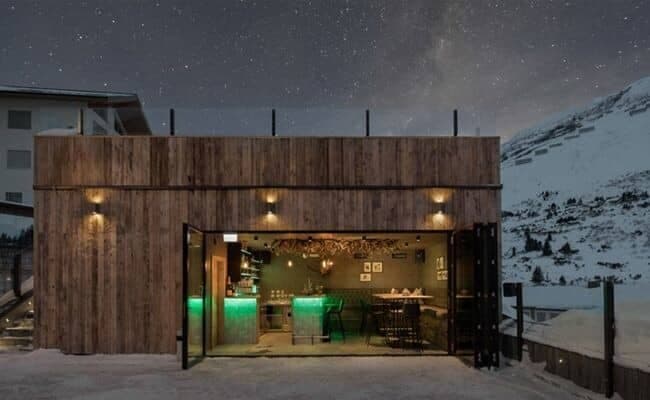 Ski-in/ski-out après-ski bar with bi-fold doors and mountain views