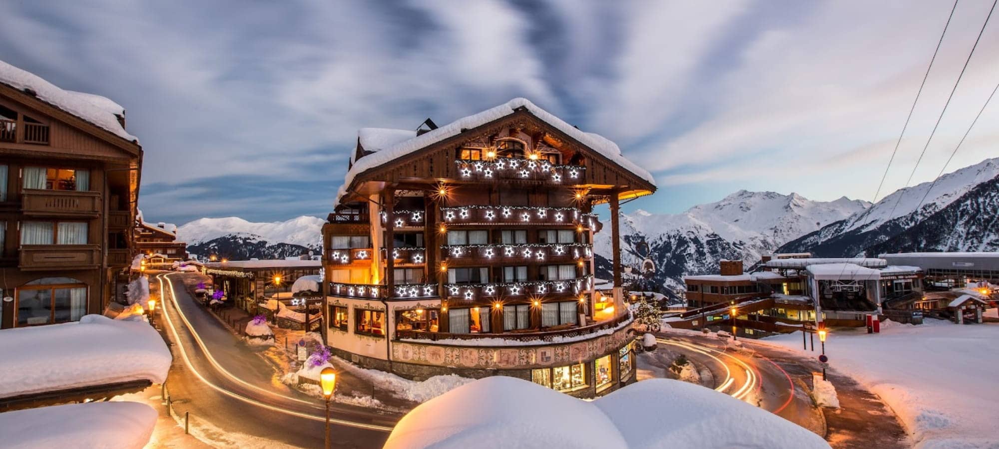Ski-in/ski-out chalet exterior with mountain views and proximity to gondola