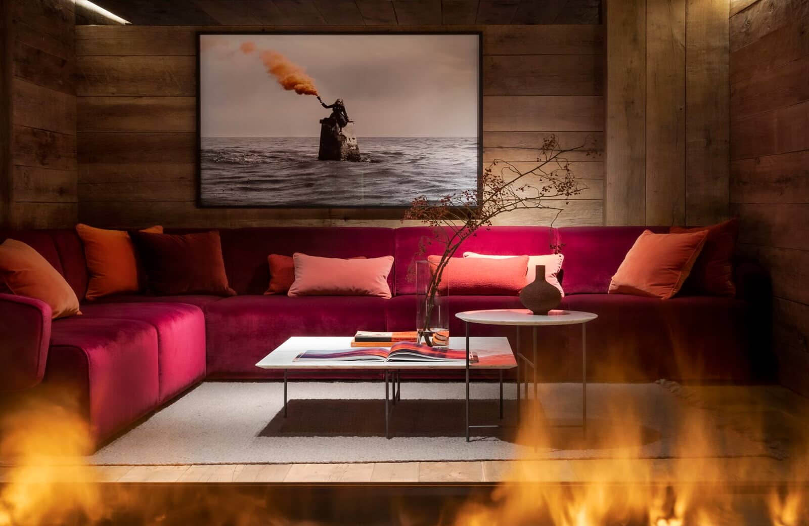 Media room with velvet sectional and wood-paneled walls