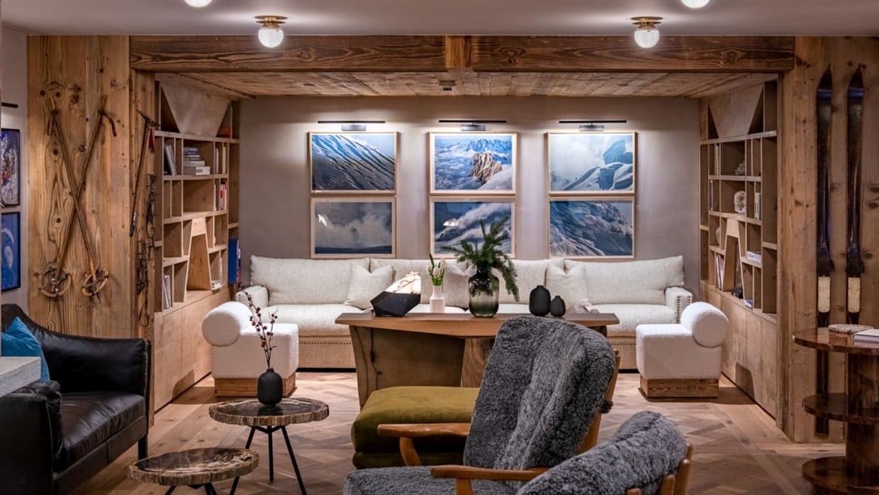 Lower level lounge with built-in library and parquet wood flooring