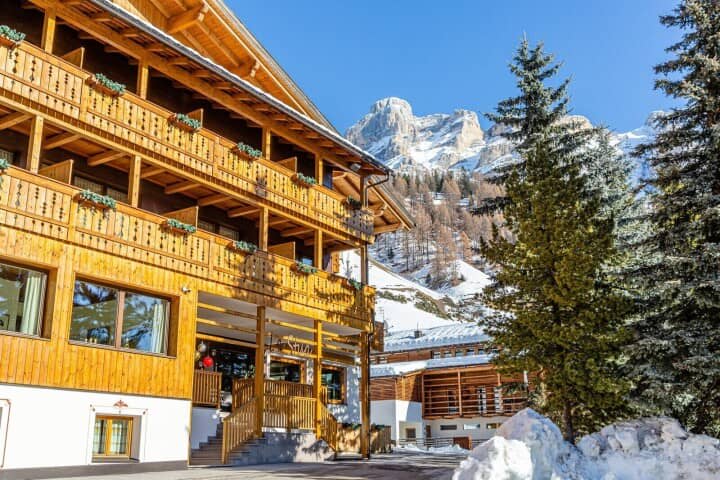 Chalet exterior with private balconies and Dolomites mountain views