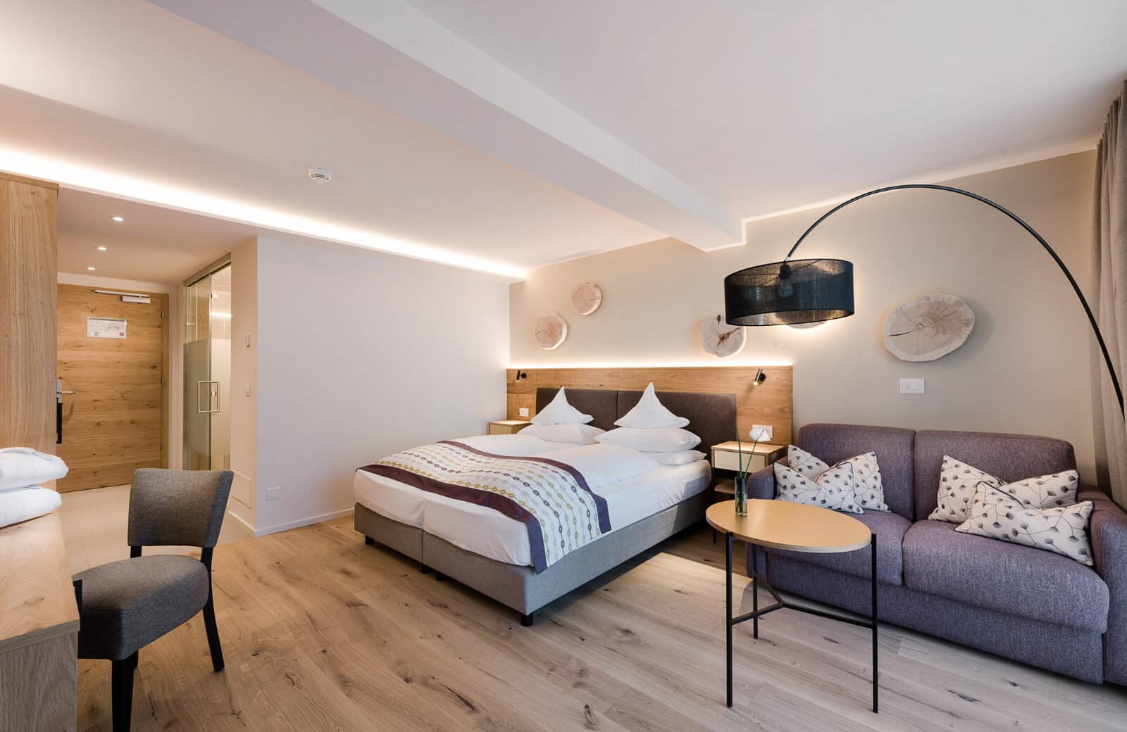 Studio bedroom with king bed and integrated sofa seating area