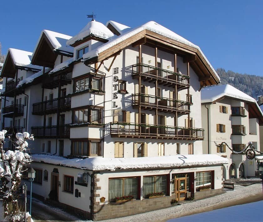 Chalet exterior with multiple private balconies and snow-covered eaves