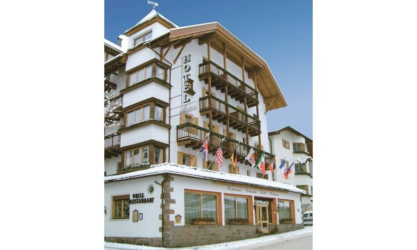 Chalet-style exterior with private balconies and on-site grill restaurant