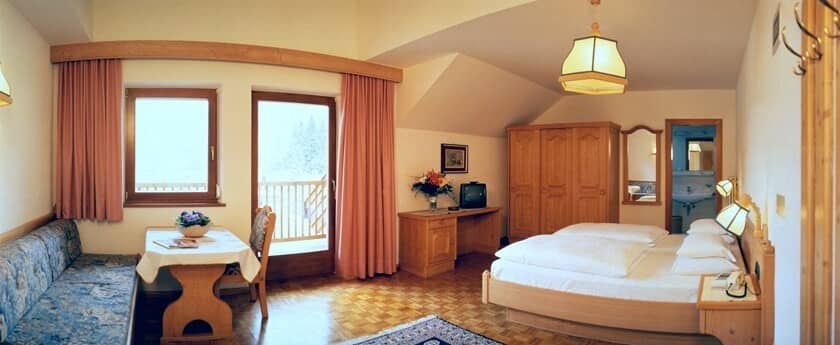 Guest suite with private balcony, ensuite bathroom, and integrated workspace