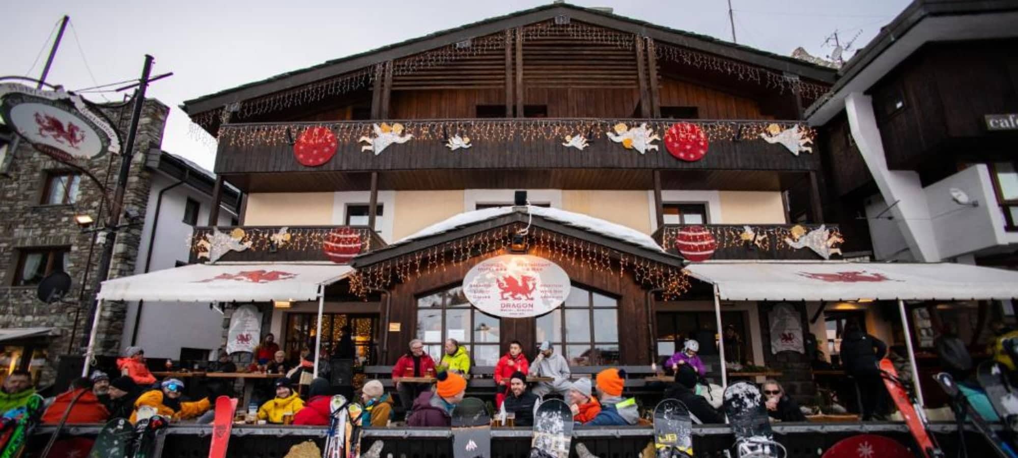 Chalet exterior with on-site restaurant and outdoor après-ski terrace
