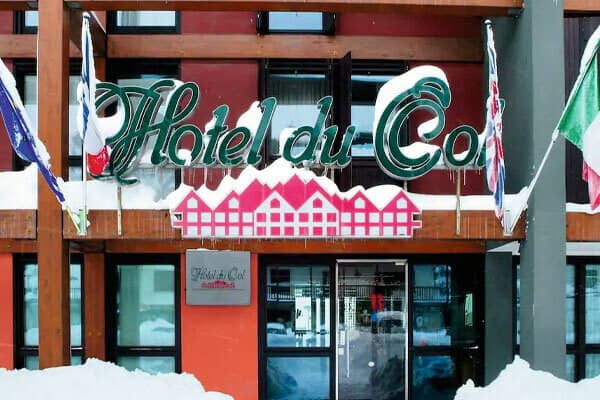 Hotel entrance with ski-in access and property signage