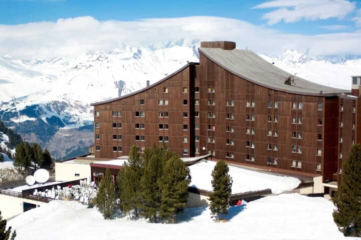 Ski-in/ski-out lodge exterior featuring south-facing terrace and mountain views