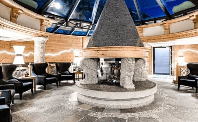 Lounge with central 360-degree fireplace and glass atrium ceiling