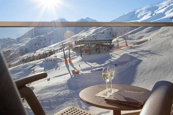 Private balcony overlooking ski slopes and nearby lift station