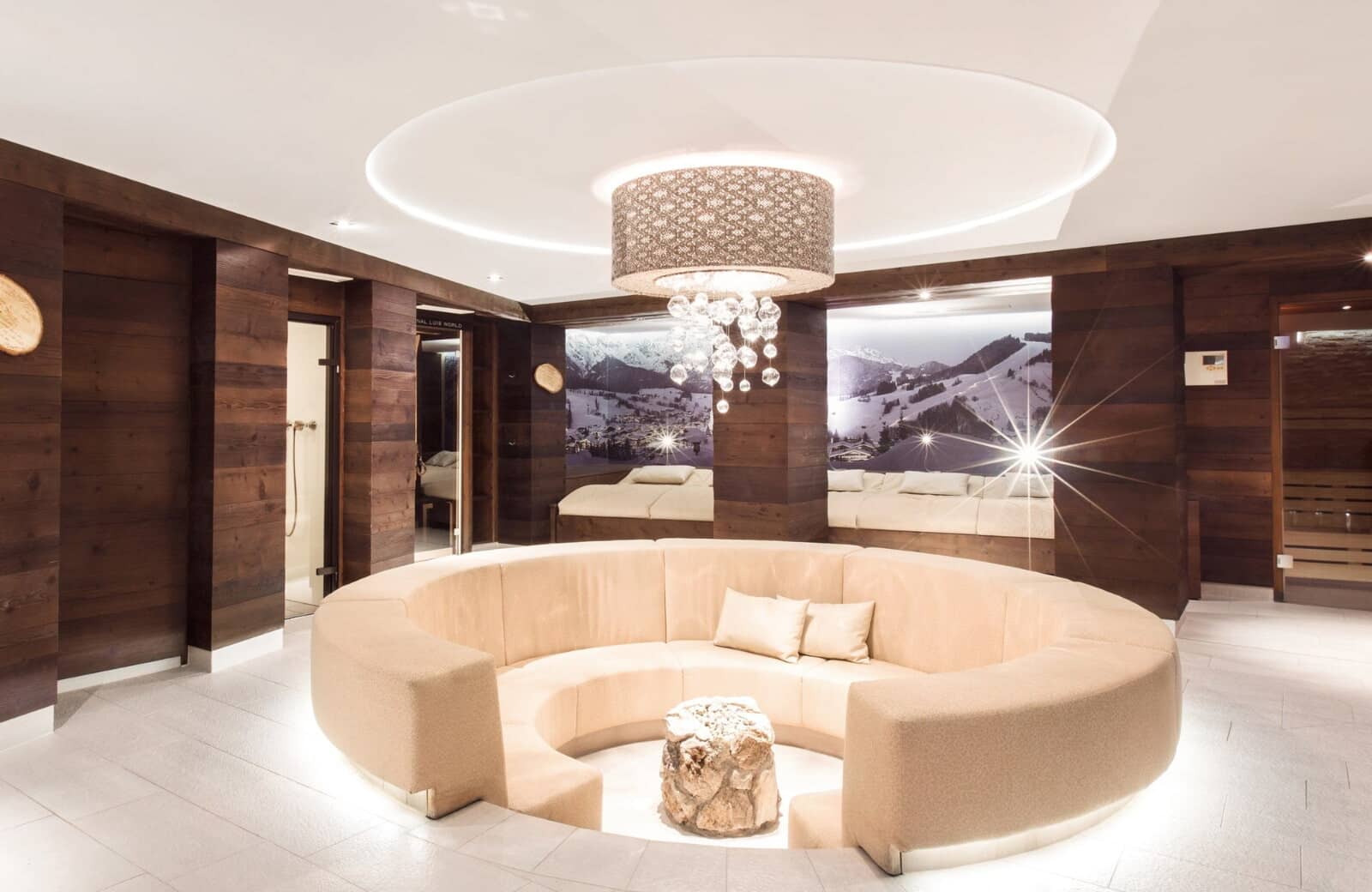 Spa lounge with circular conversation pit, dry sauna, and walk-in shower