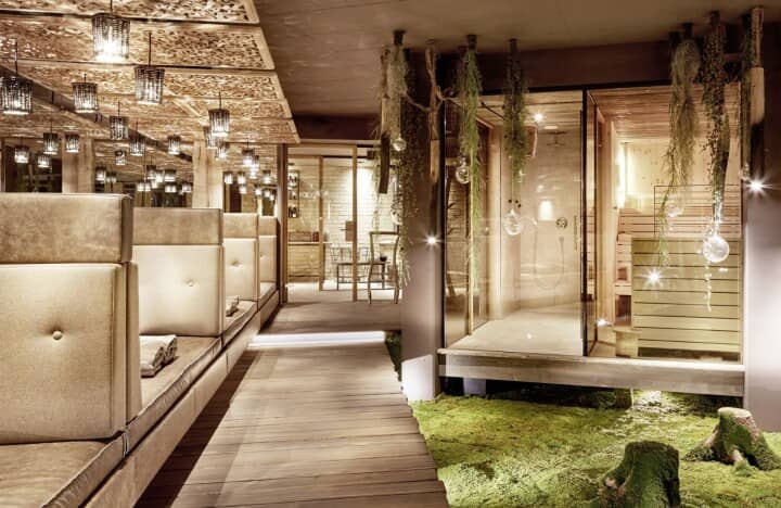 Spa lounge area featuring daybeds, glass shower, and indoor sauna