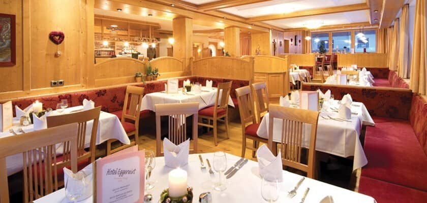 Dining room with booth seating and pine wood paneling