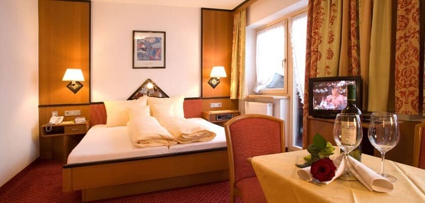 Bedroom with king bed and bistro table for two