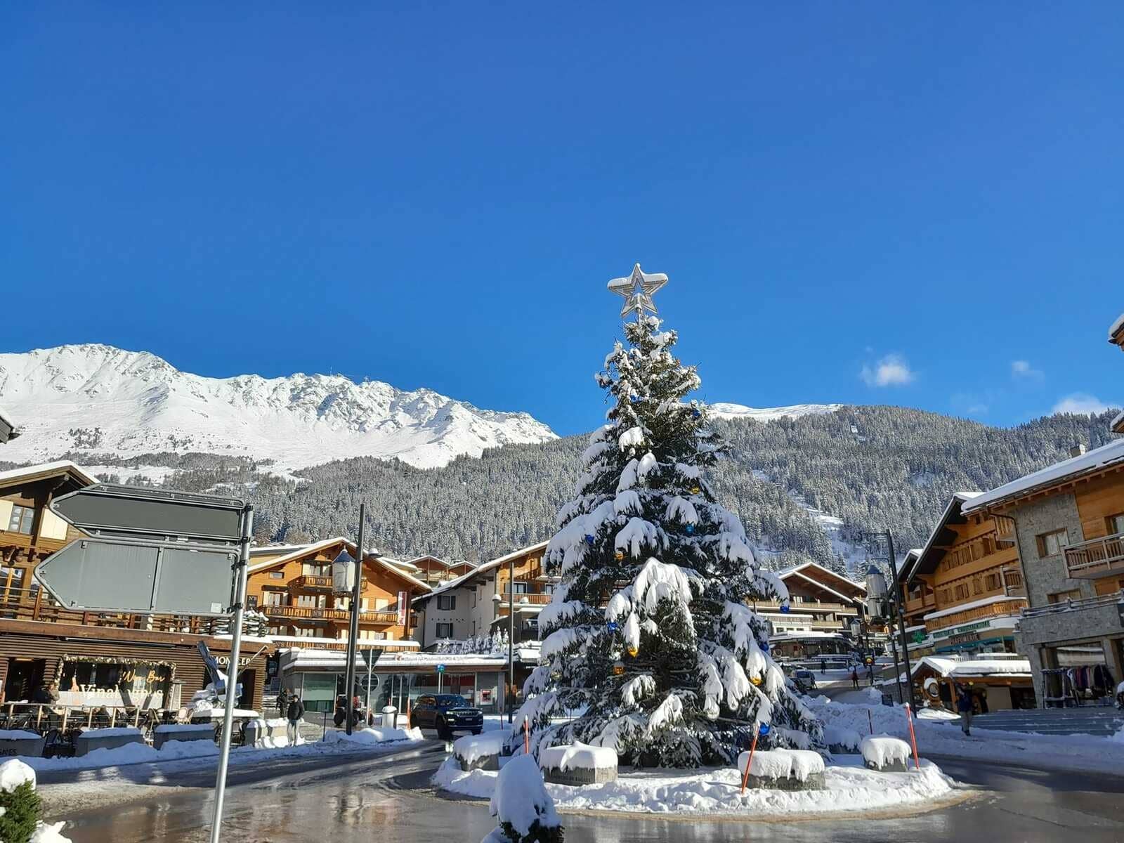 Ski village center with shops and mountain views; 5-minute walk from property