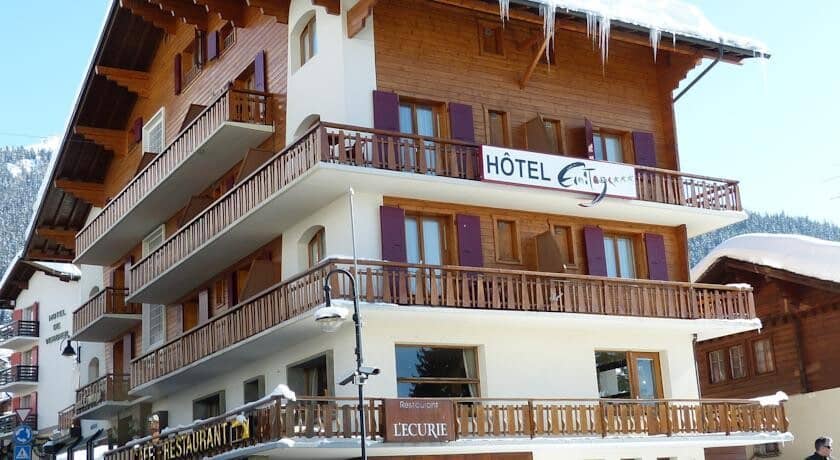 Chalet exterior with private balconies and on-site restaurant L'Ecurie