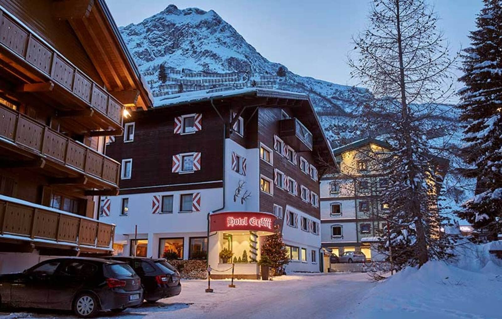 Chalet entrance with on-site parking and mountain views