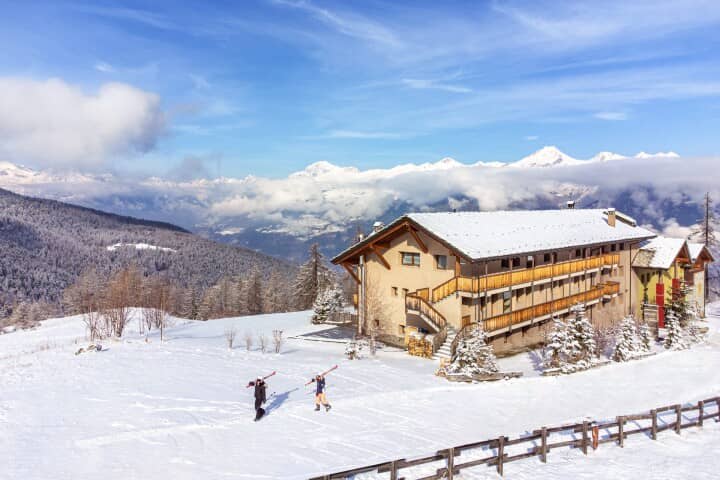 Ski-in/ski-out chalet exterior with mountain views and direct piste access