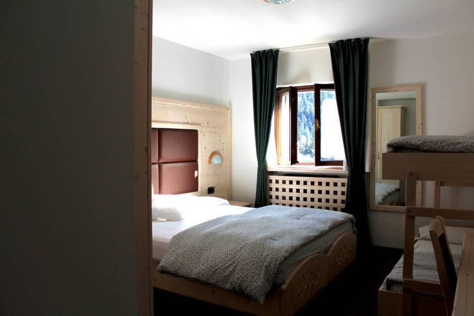 Guest bedroom with double bed and twin bunk beds; sleeps 4
