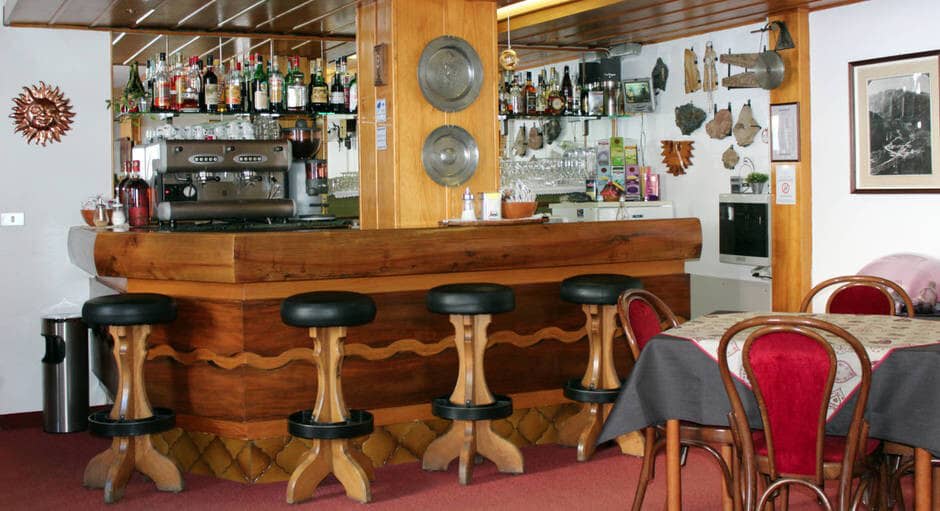 Private bar area with espresso machine and seating for 4