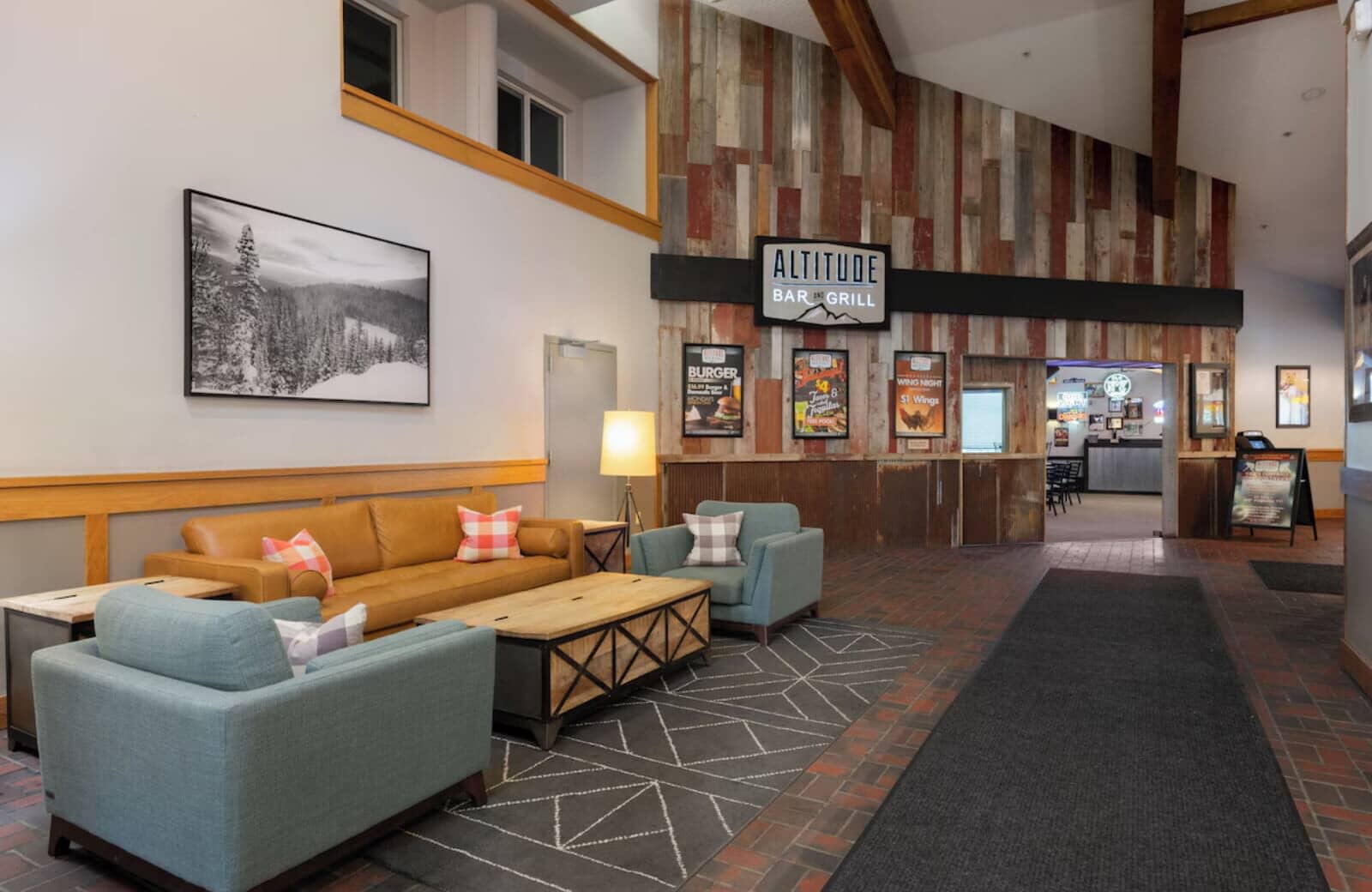 Building lobby lounge with seating; adjacent to on-site Altitude Bar and Grill