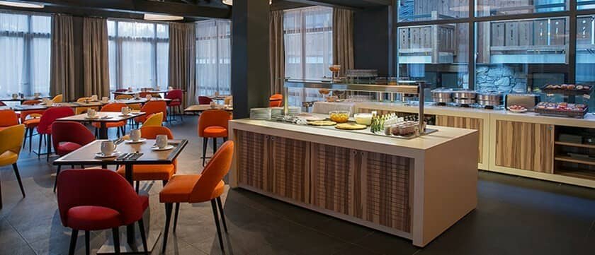 Shared dining area with buffet service and seating for large groups