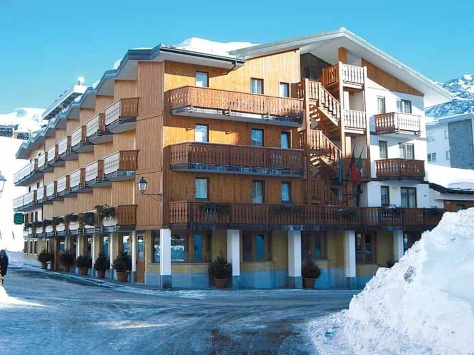 Ski resort exterior with private balconies and street-level access to shops