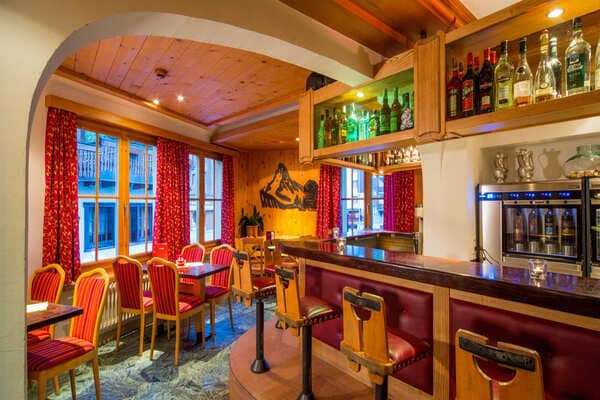 Private bar area with stool seating and integrated wine dispenser