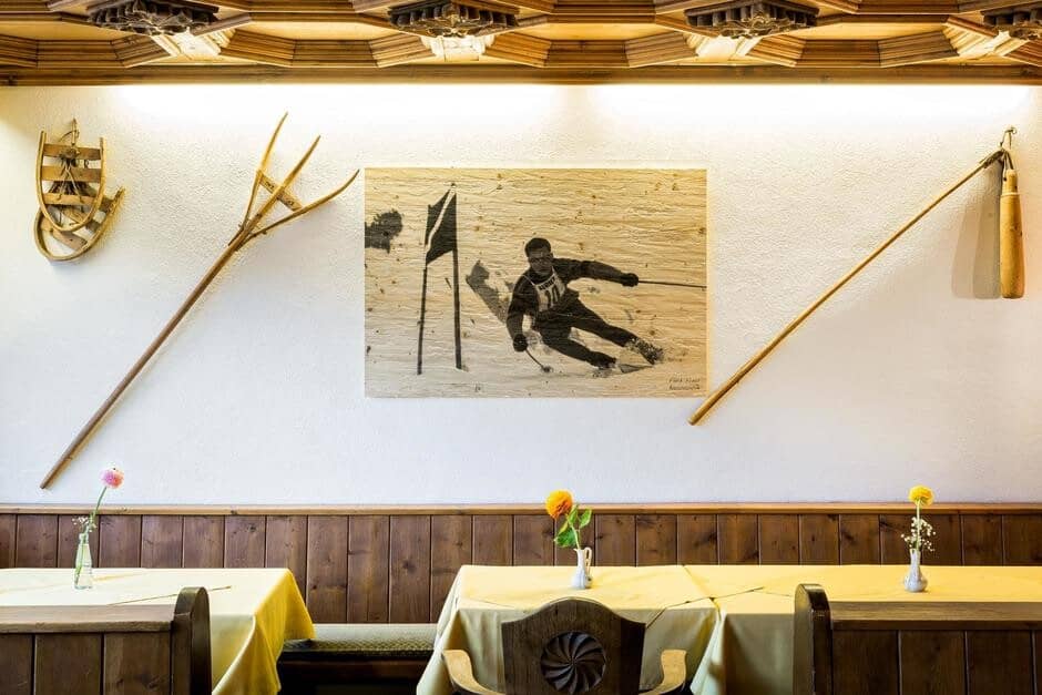 Dining area with booth seating and vintage Alpine decor