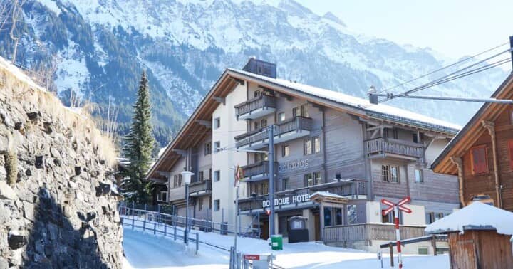 Chalet exterior located directly adjacent to ski slopes and mountain trails