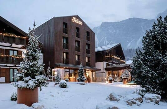 Chalet exterior featuring private balconies and mountain views