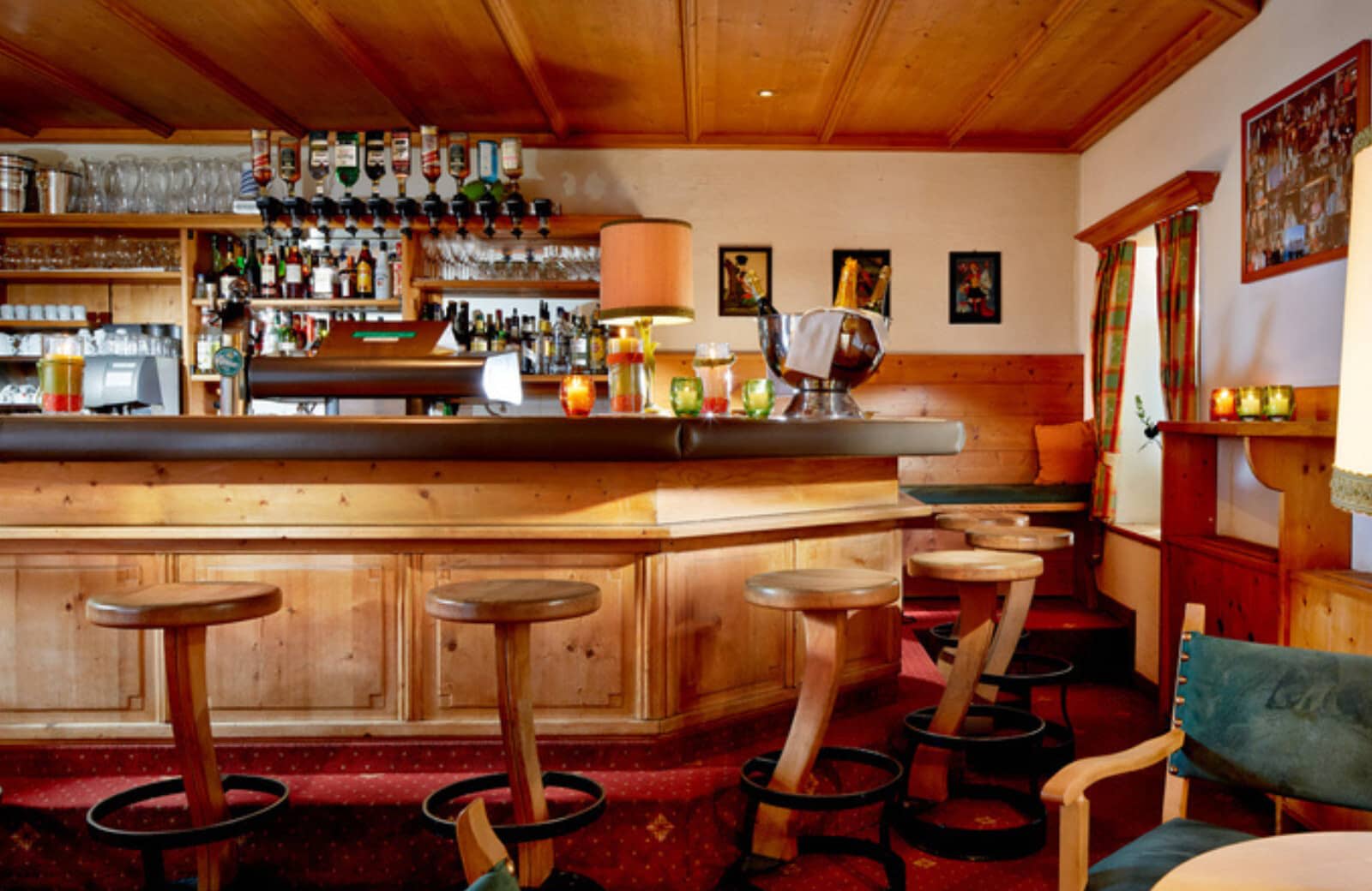 Private timber bar with upholstered stools and draught beer taps