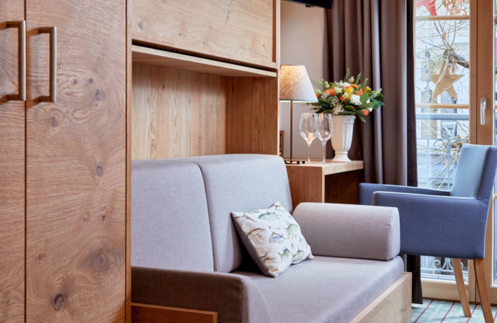 Studio living area with Murphy bed and workstation