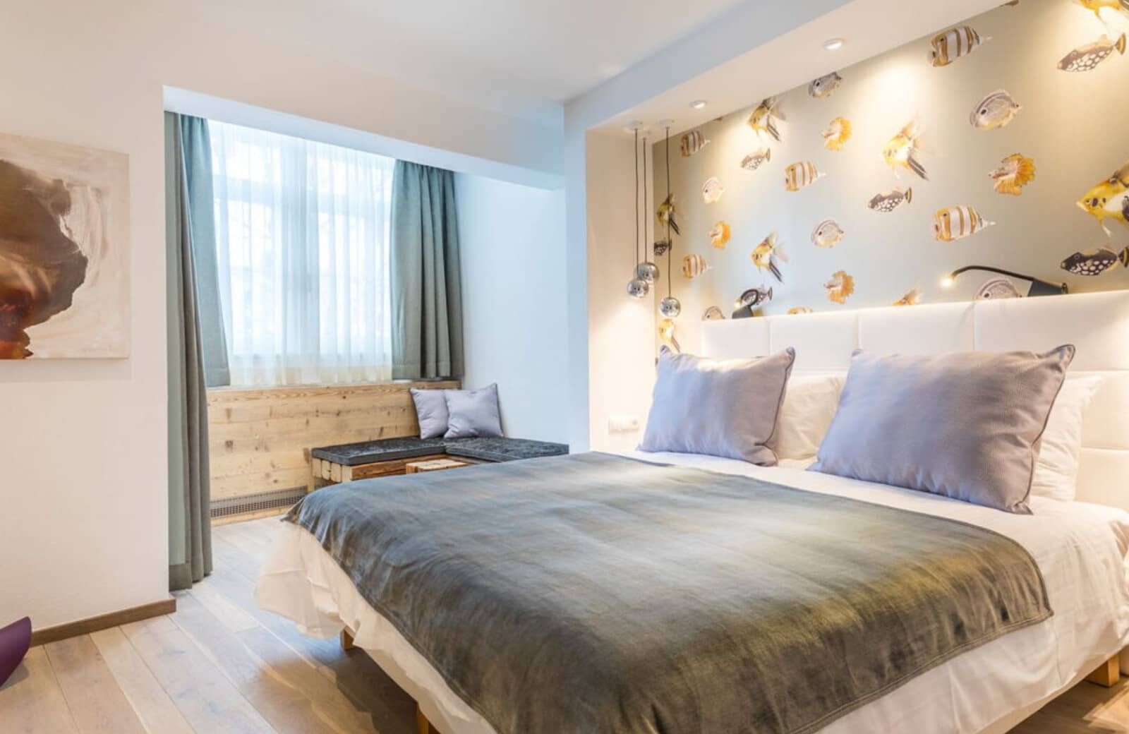 Bedroom with king bed and window nook seating area