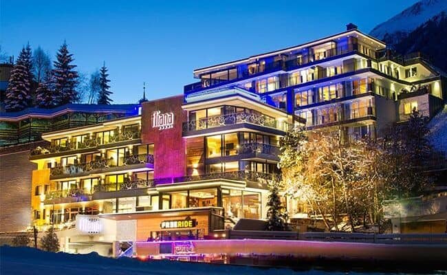 Ski-in/ski-out resort exterior with private balconies and mountain views