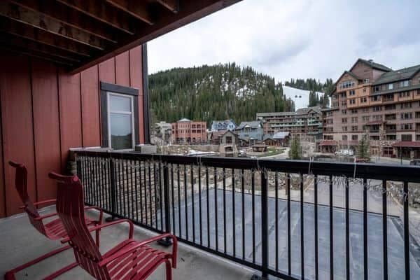 Covered private balcony with village and ski slope views