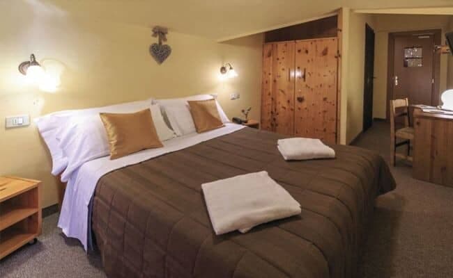 Bedroom with king bed and built-in wood wardrobe