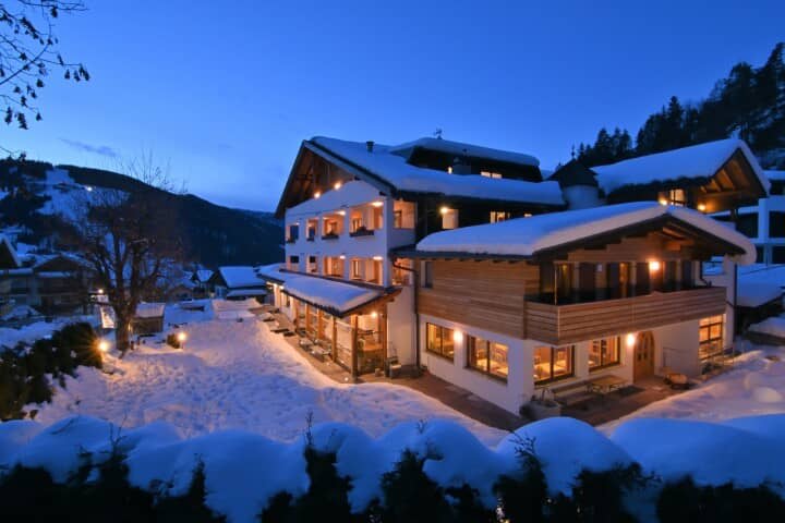 Ski-in/ski-out lodge exterior with private balconies and mountain views