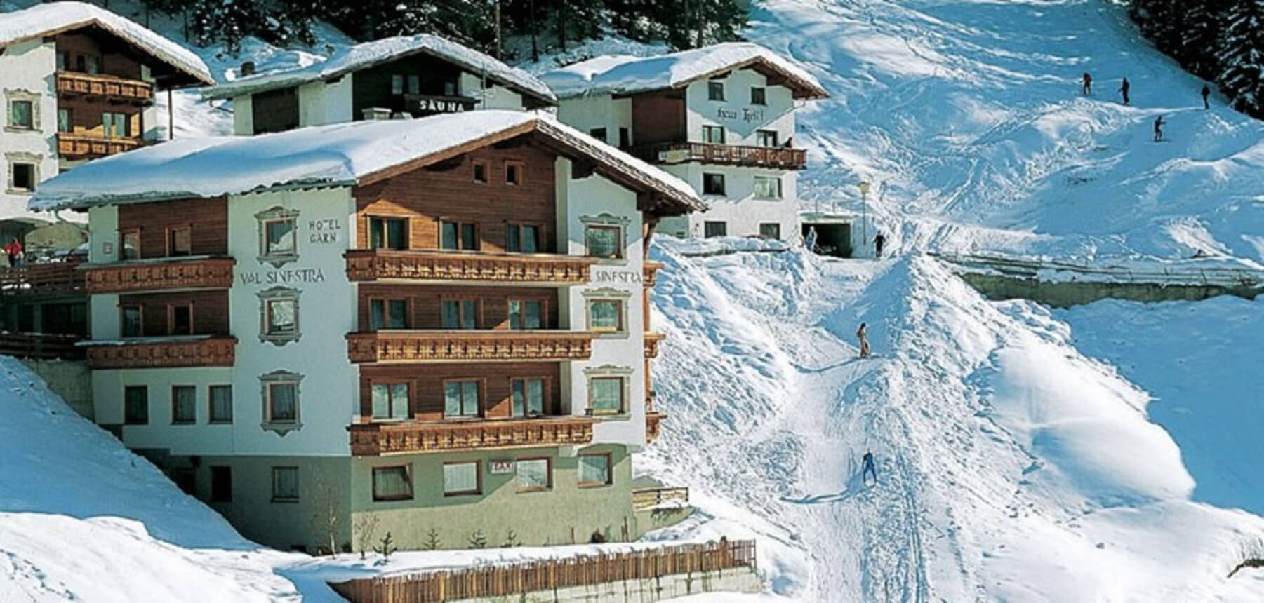 Ski-in/ski-out chalet exterior with direct access to groomed mountain trails