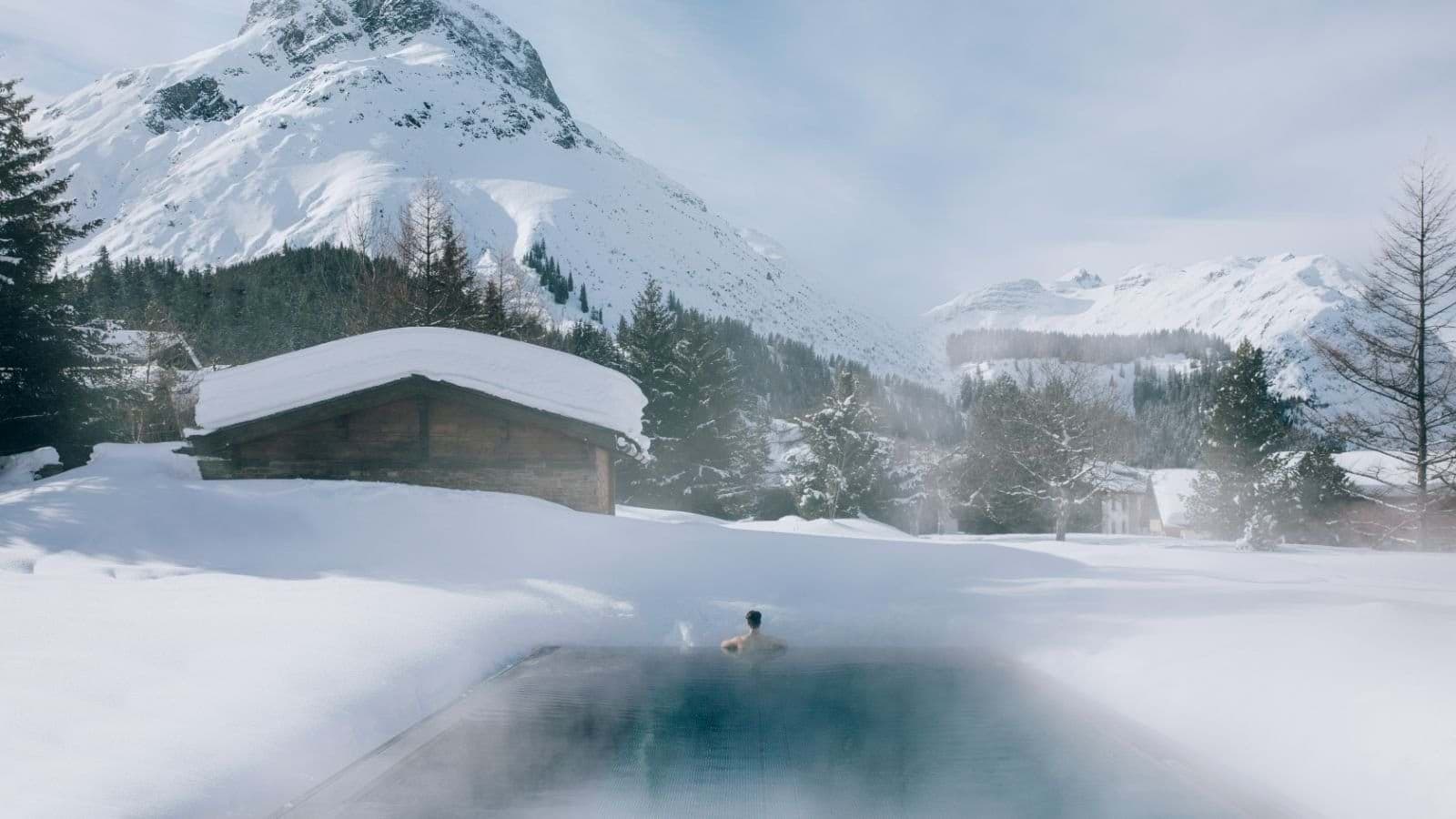 Heated outdoor pool with mountain views and infinity edge