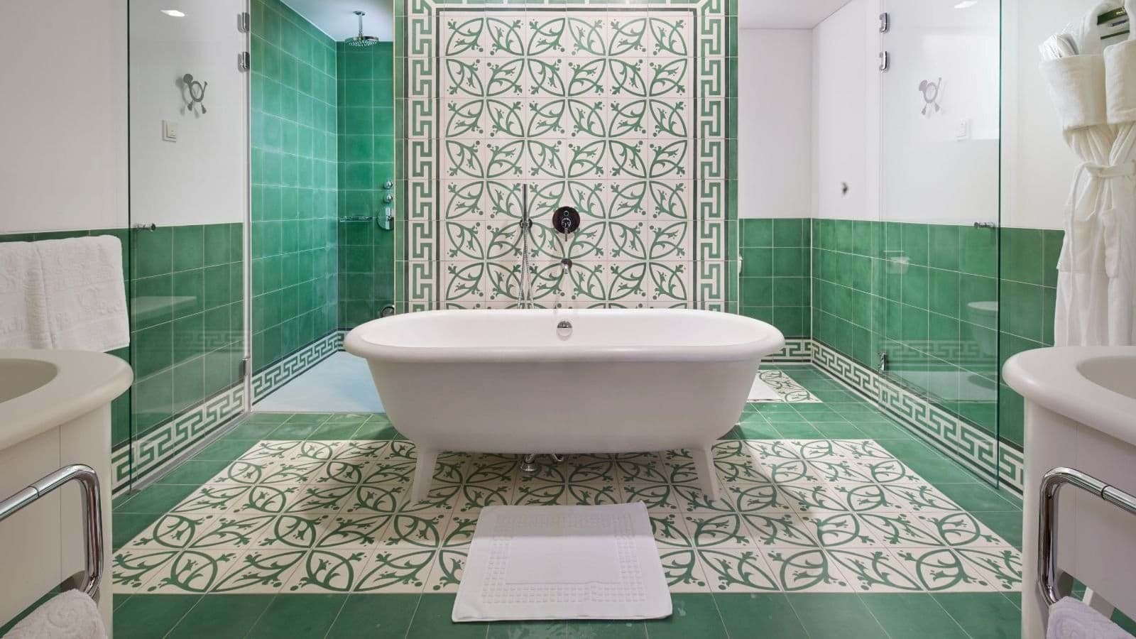 Bathroom with clawfoot soaking tub and walk-in rainfall shower