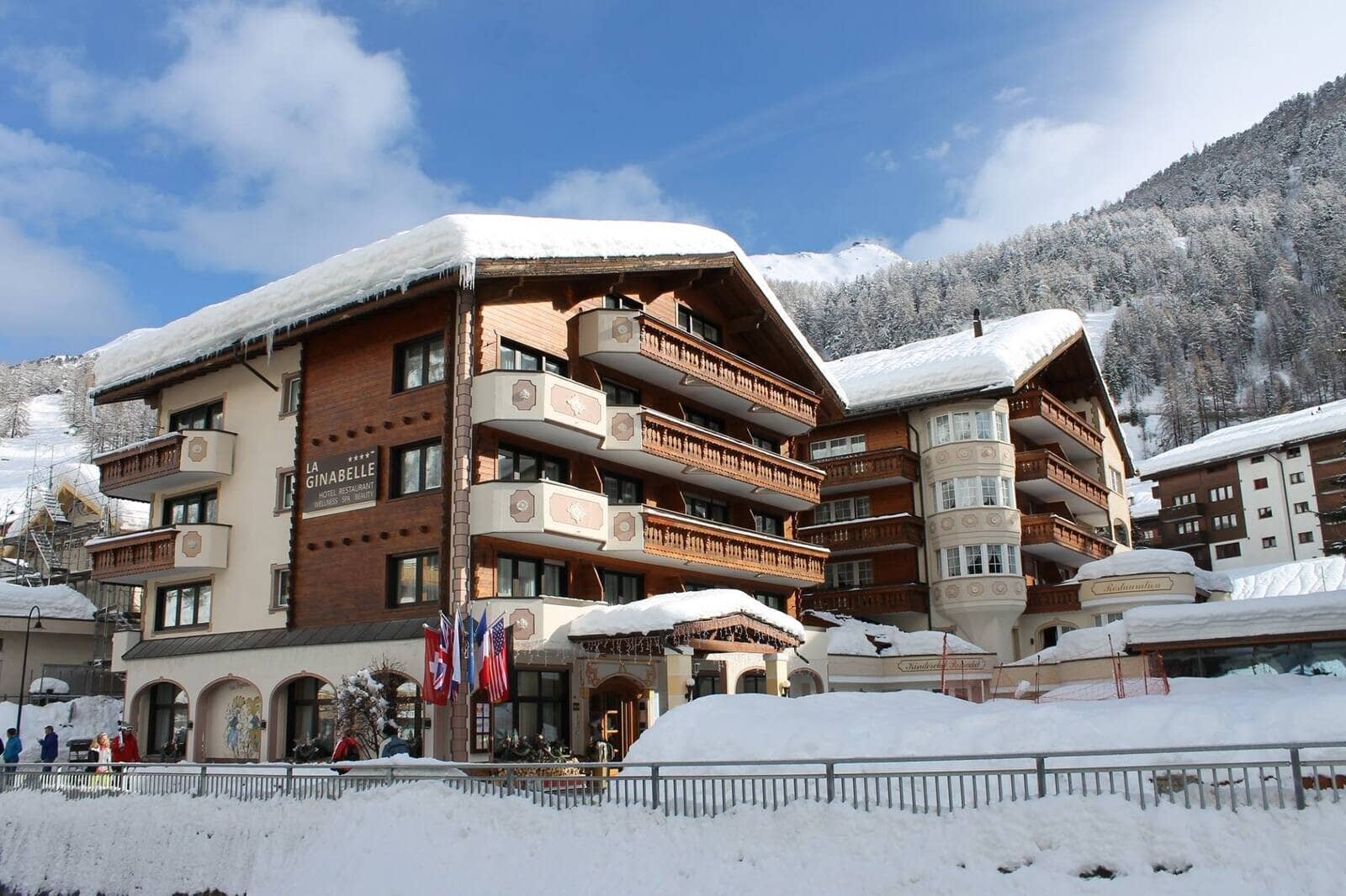 Chalet-style exterior with private balconies and mountain views